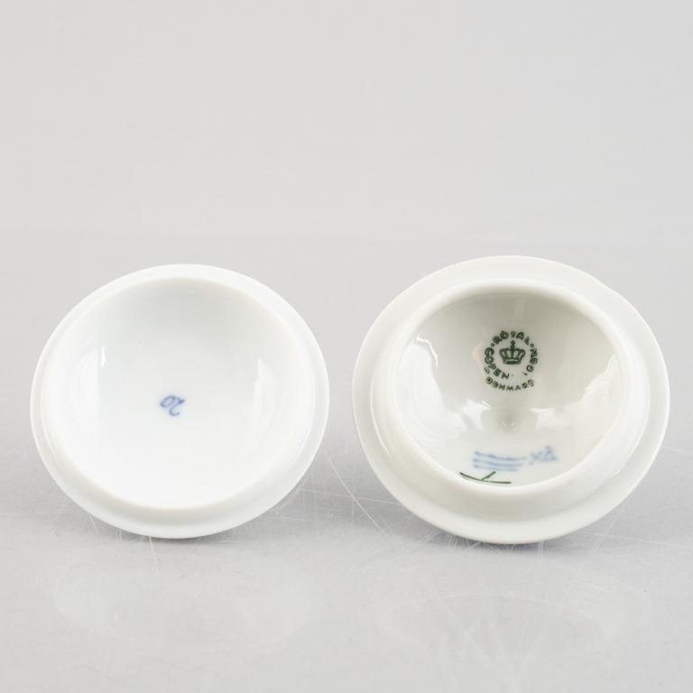 Two 'Blue Fluted' / 'Musselmalet rifflet' porcelain cream cups with covers, Royal Copenhagen, 19th century and 1964.