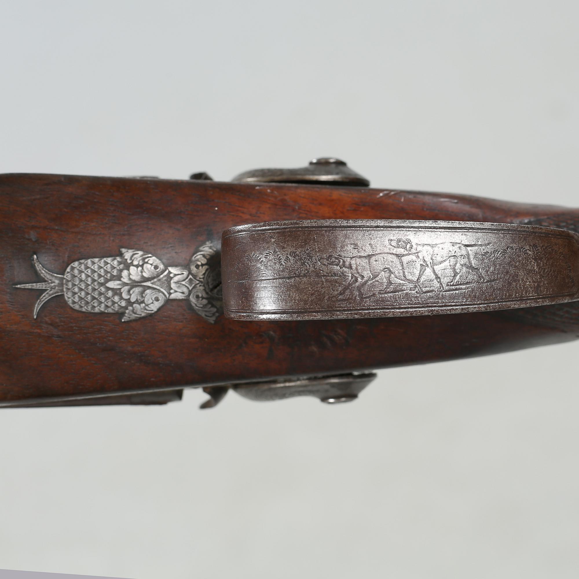 A percussion rifle by Charles William Lanchester in London, around the mid 19th century.