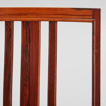 Bertil Fridhagen, a rosewood-veneered dining table with four chairs, BOdsfors, Sweden, 1960's.