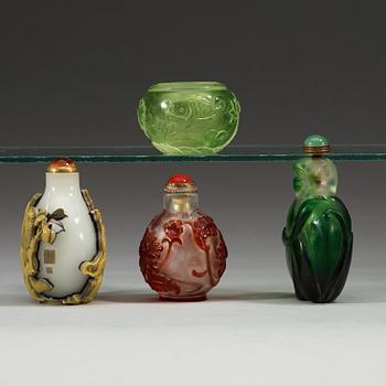 A set of three Peking glass snuff bottles with stoppers and a brush washer.