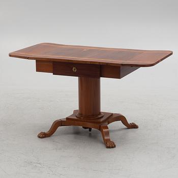 Table with folding leaves, Empire style, 19th century.