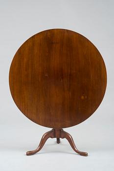 A TILT-TOP TABLE.