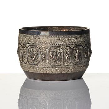 A Chinese brushpot, Qing dynasty, circa 1900. An archaistic bronze ewer and a silvered South East Asian bowl with stand.