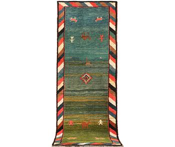 A Gabbeh runner, c. 305 x 103 cm.