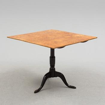 A 19th century folding table with root veneer.