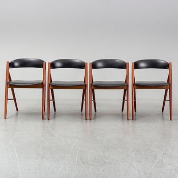 Four 1960s teak chairs.