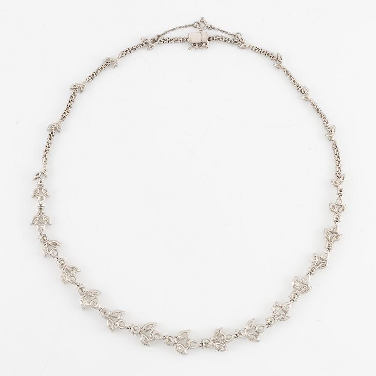A platinum necklace set with navette-, pear- and round-brilliant-cut diamonds.