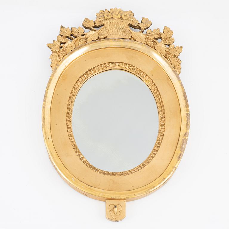 An Empire giltwood mirrored wall sconce by J. M. Berg (active in Gothenburg 1803- ca 1837).