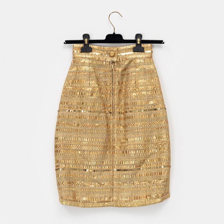 Chanel, a gold bouclé skirt, size 34.