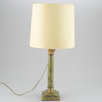 A 20th century empire style table lamp.