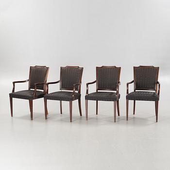 An english style dining table and eight chairs, second half of the 20th century.