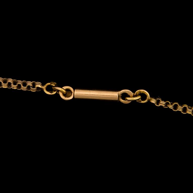 A PENDANT, facetted demantoids, 14K (56) gold. St Petersburg 1864-1908.