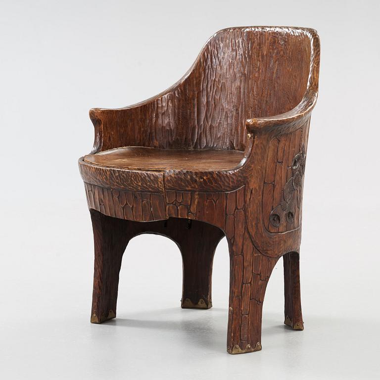 A Gustav Fjaestad Art Nouveau carved pine chair, 'Stabbestol', by Adolf Swanson, Arvika, Sweden 1908.