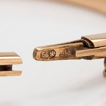 A 14K gold bangle, set with old-cut diamonds, St. Petersburg 1882-1898.