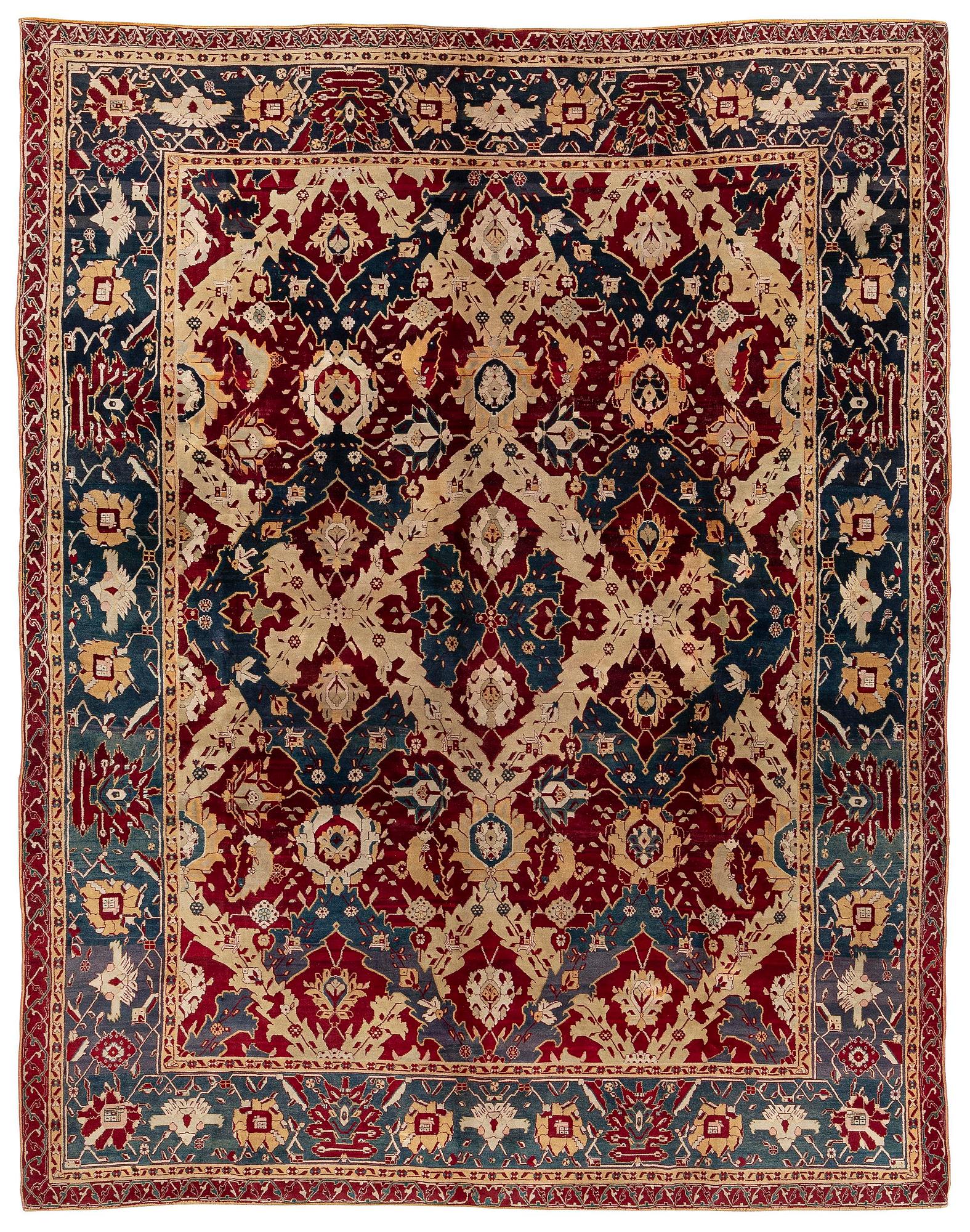An Antique Agra carpet of 'Dragon Lattice' design, North India, 375 x 298 cm.