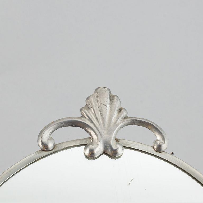 A set of a pewter mirror and two girandole mirrors.