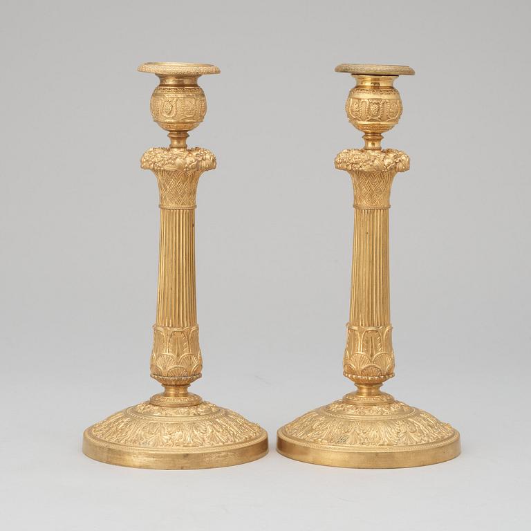 A pair of French Empire early 19th century candlesticks.