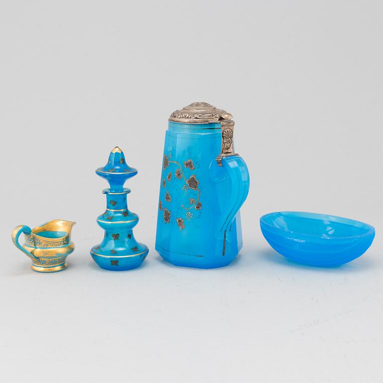 A silver gilt turkoise glass tankard, bottle with stopper, bowl and a small creamer, 19th Century.