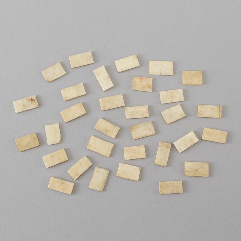 A COLLECTION OF 31 BONE MINIATURE DOMINO GAME PIECES,  18th/19th century.