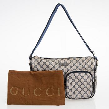 Gucci, A "GG Supreme messenger" bag.
