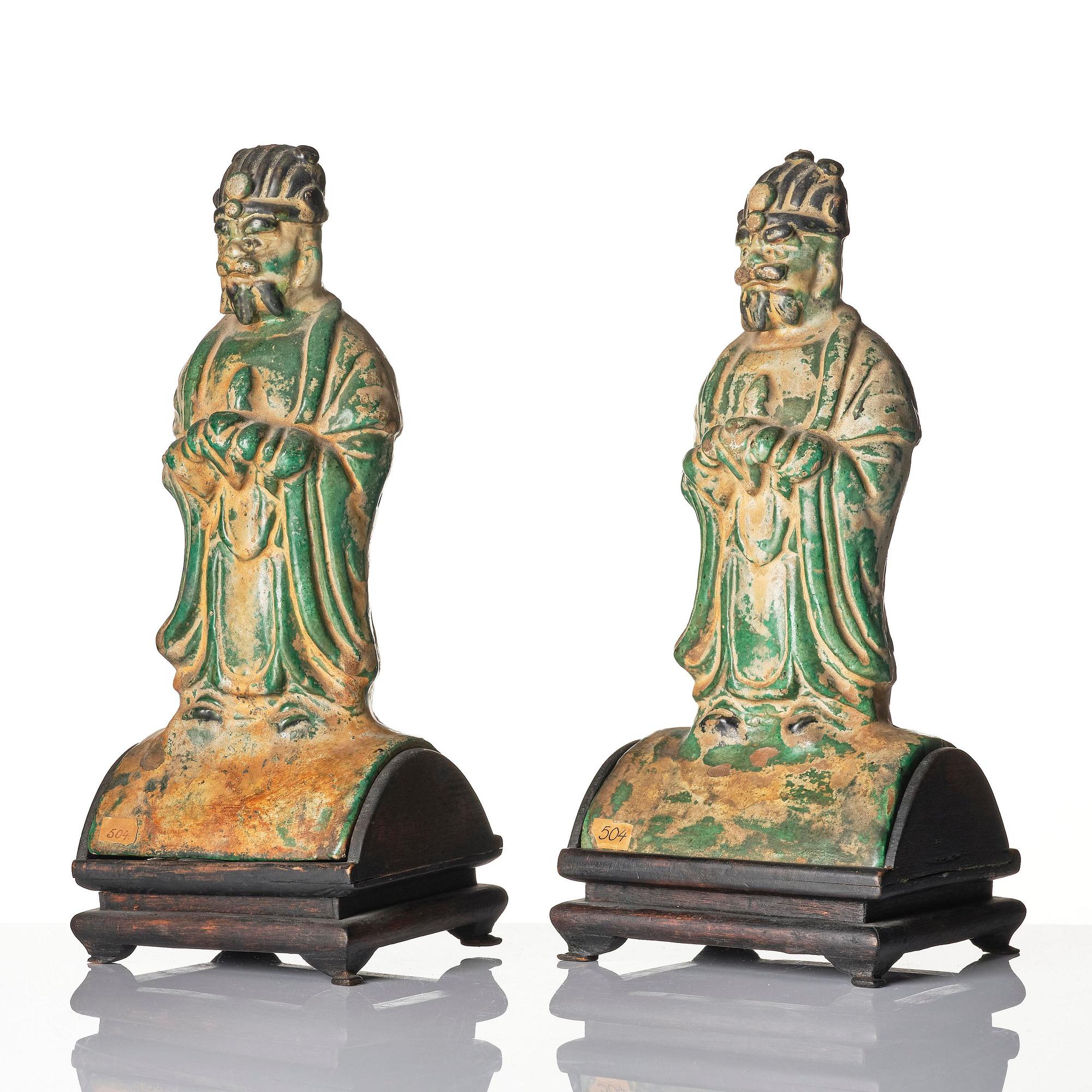 A pair of green and yellow glazed roof tiles figures, Ming dynasty (1368-1644).