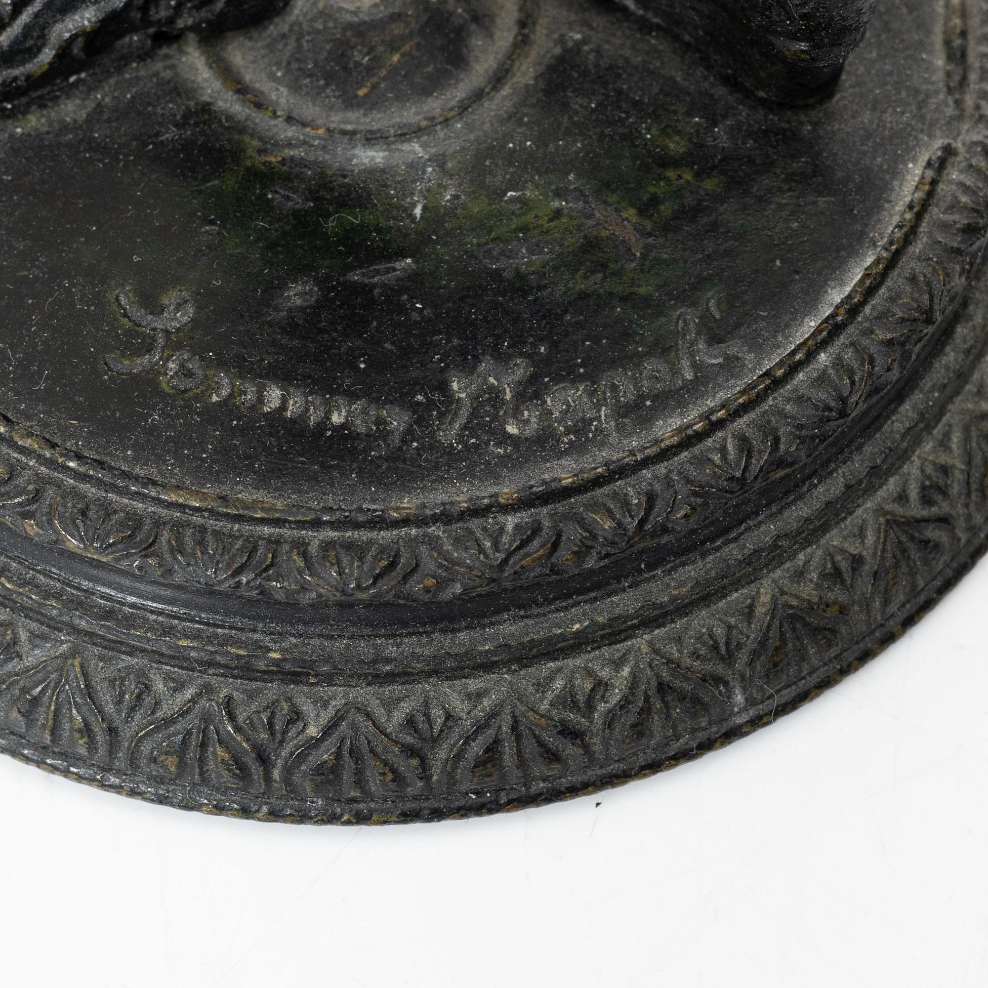 Two bronze sculptures.