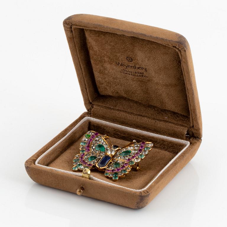 A butterfly brooch/pendant in 14K gold set with old-cut diamonds.