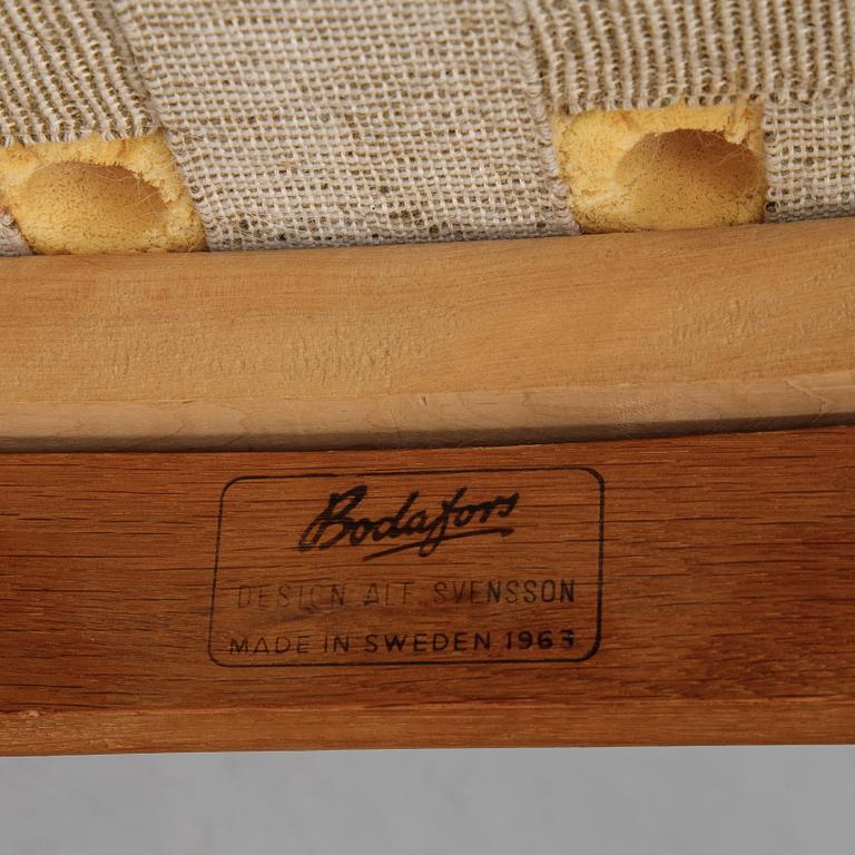 A pair of easy chairs by Alf Svensson for Bodafors, dated 1963.