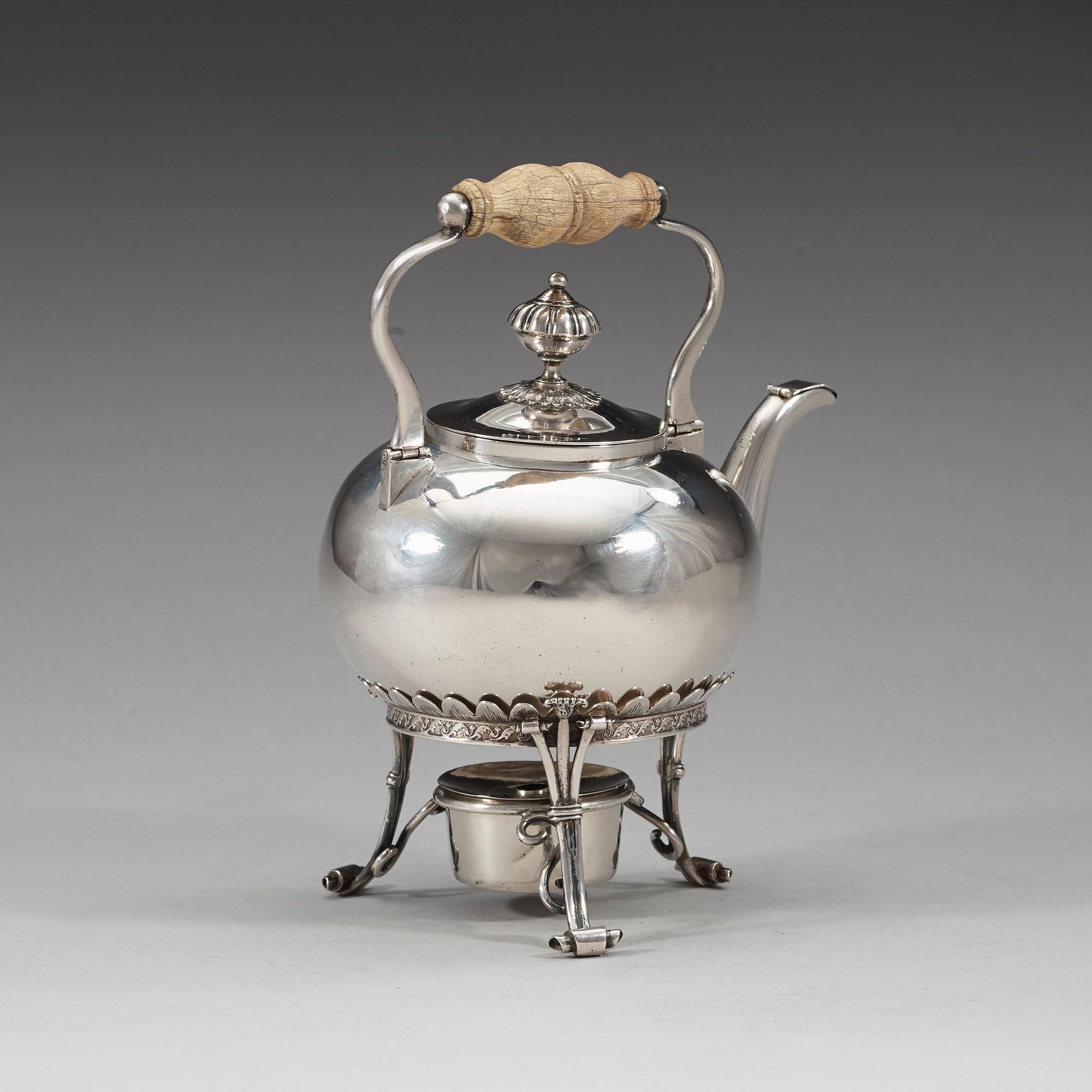 A Swedish 19th century silver tea-pot and stand, marks of Barkander & Söhrling, Linköping 1830.