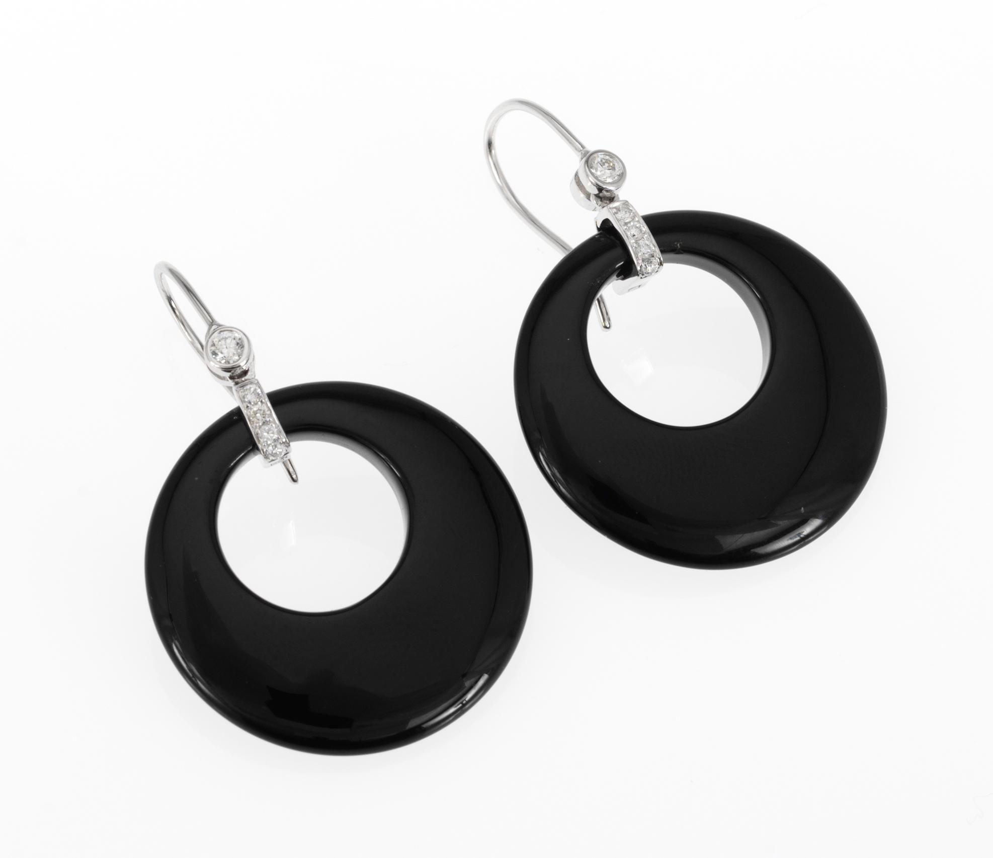 EARRINGS, onyx set with brilliant cut diamonds, tot. app. 0.35 cts.