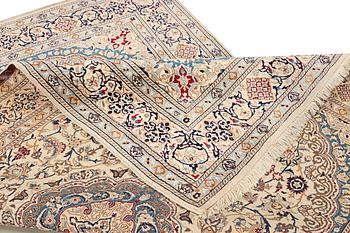 A Nain carpet, part silk, 9 laa, c. 300 x 195 cm.