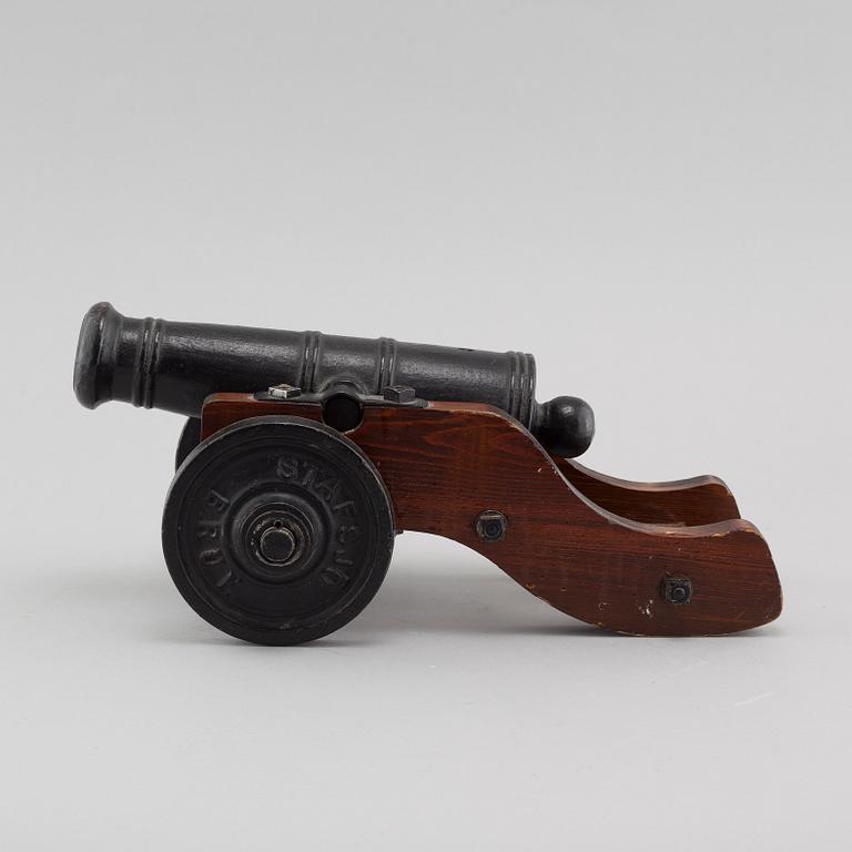 A 20th century salute cannon with wooden gun carriage by Stafsjö Bruk, Sweden.