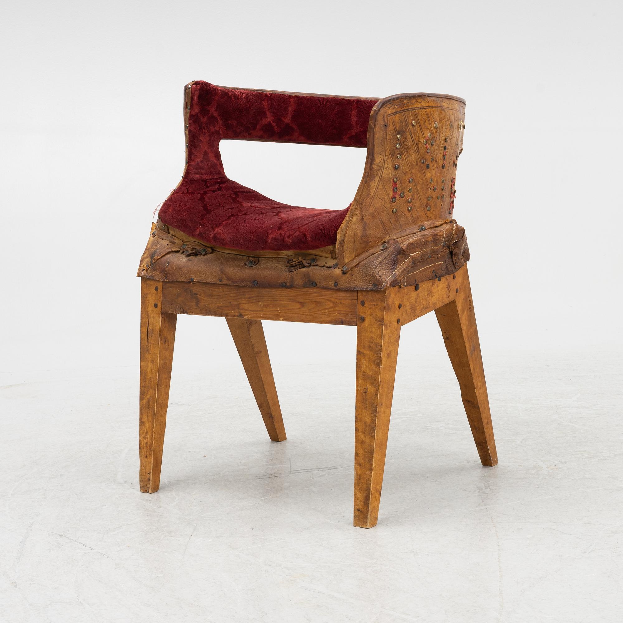 A side saddle, 18th/19th Century, mounted on legs.