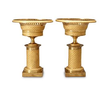 579. A pair of French Empire early 19th Century gilt bronze tazzas.