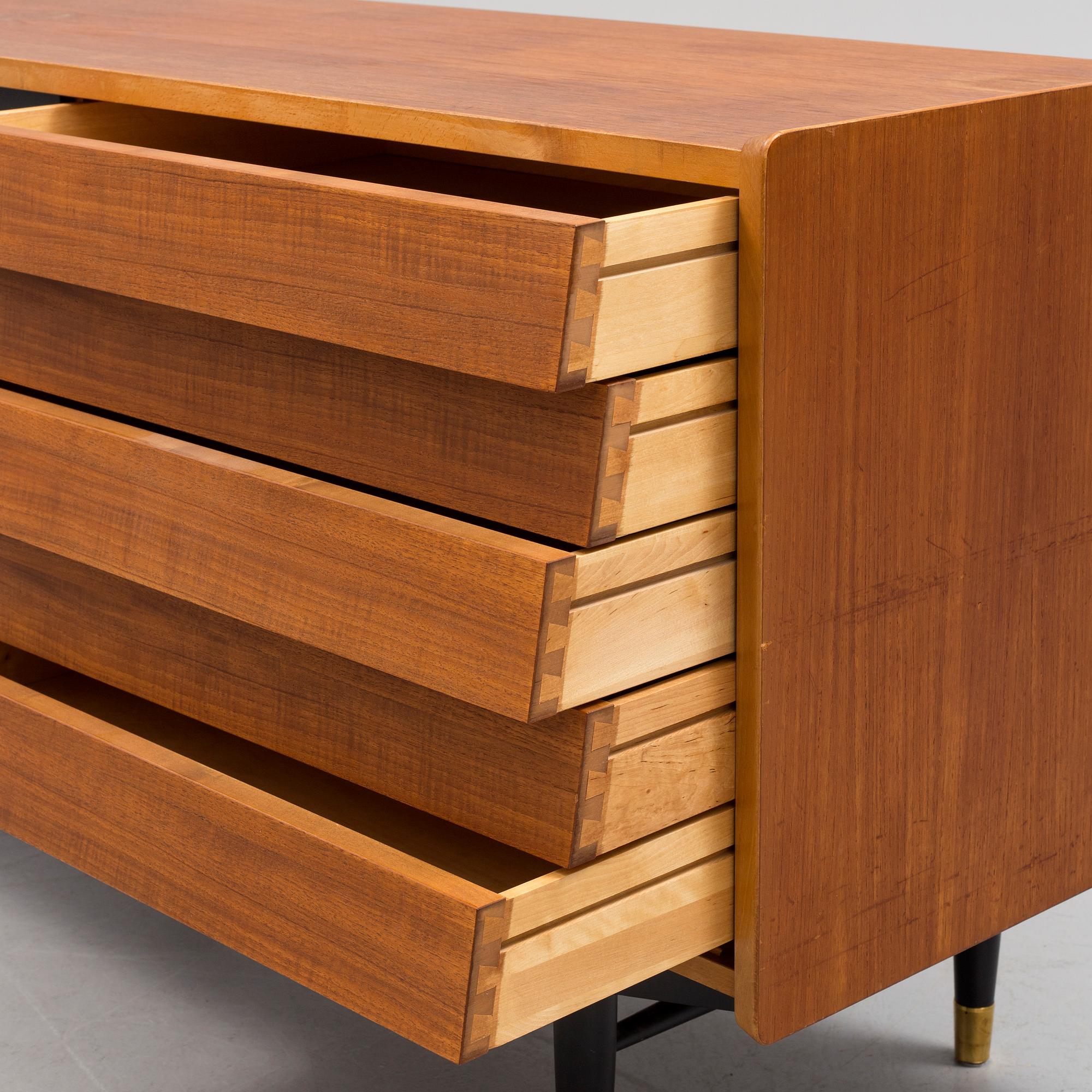 A 1950s / 60s Nils Jonsson sideboard veneered with teak model 222 from Hugo Troeds in Bjärnum.