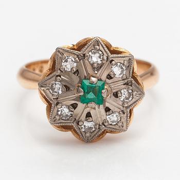 A 14K gold ring with diamonds ca. 0.40 ct in total and an emerald. Yerevan.