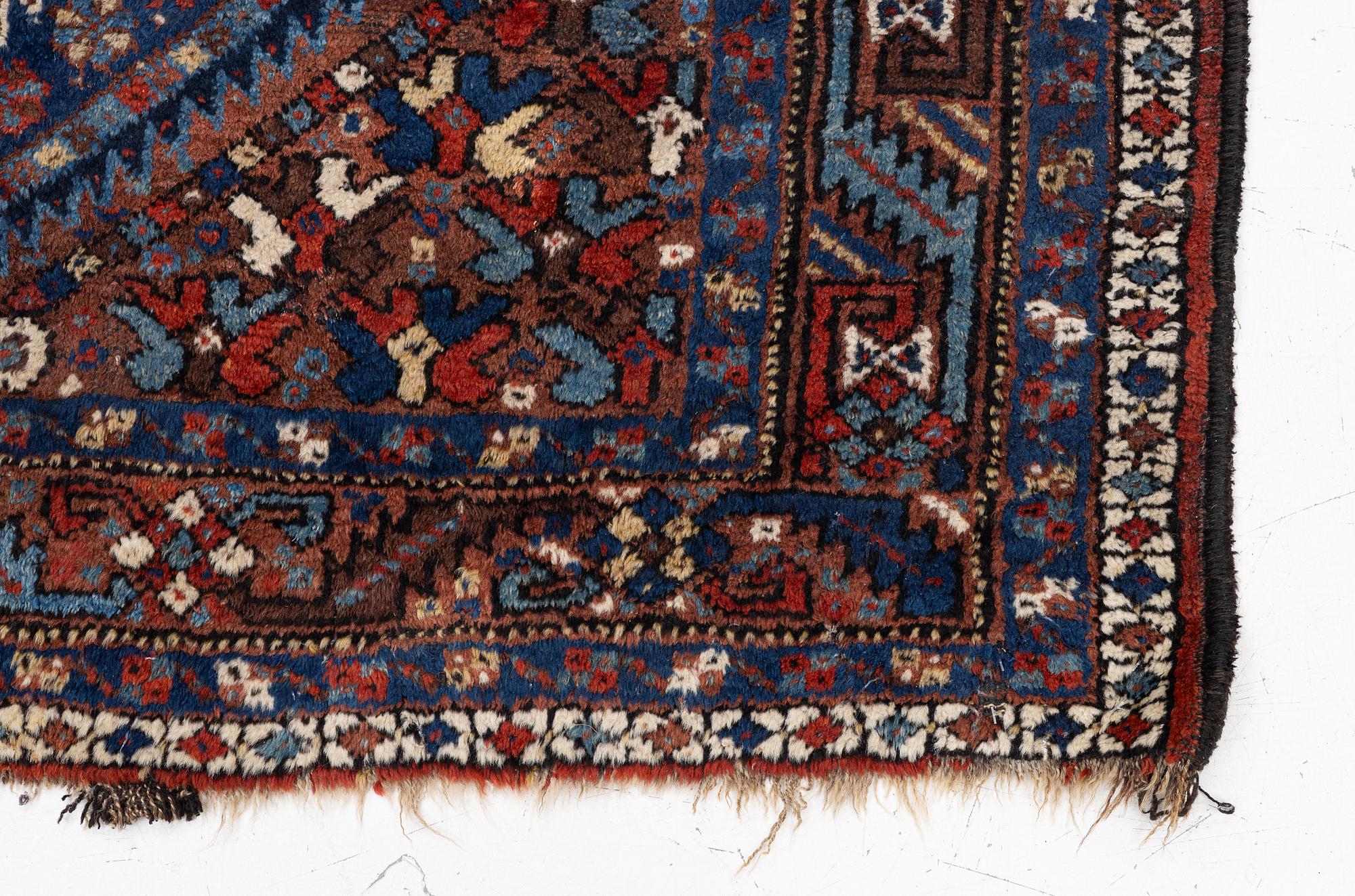 A Khamseh rug, antique, c. 192 x 155 cm.