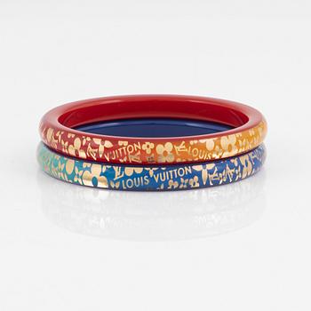 Louis Vuitton, a pair of plastic bangles.