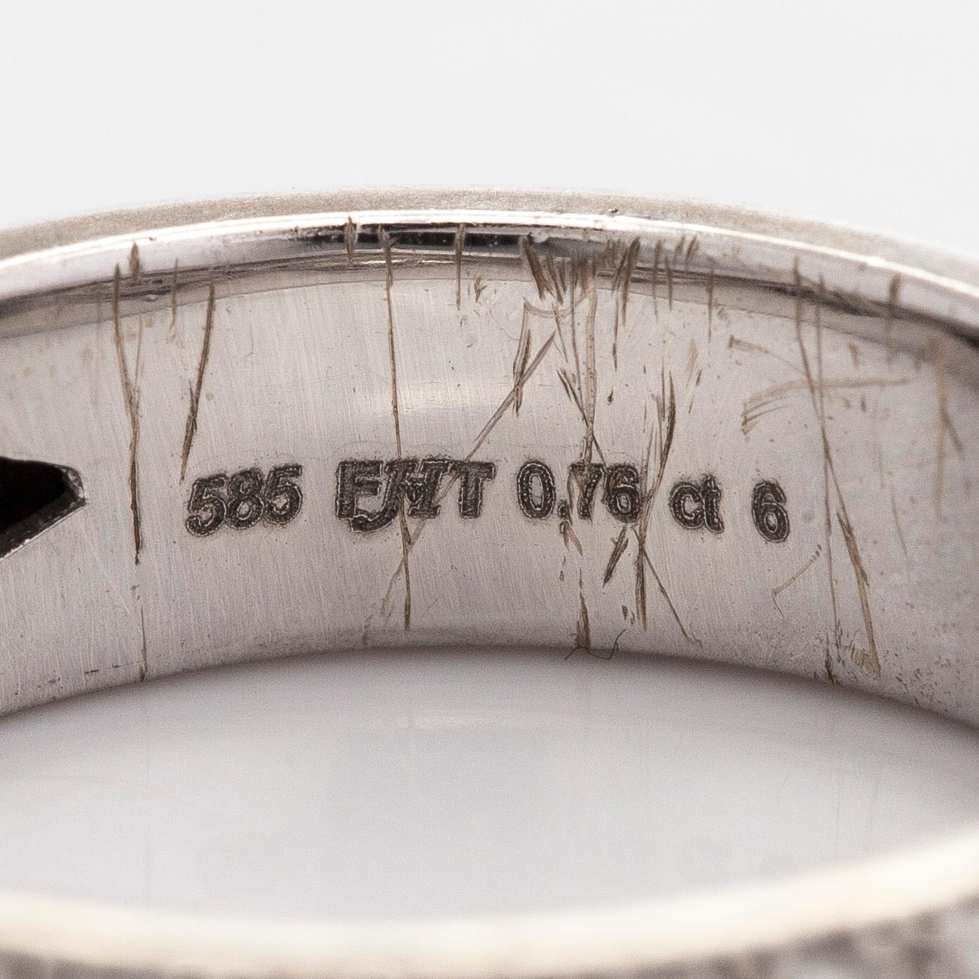 A 14K white gold ring with diamonds.