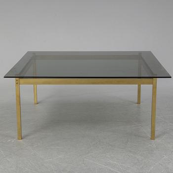 A 1960-70's brass and glass coffee table.