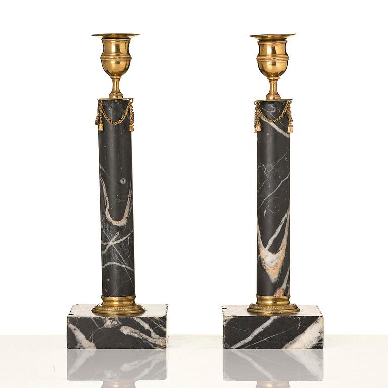 A pair of Gustavian black marble candlesticks.