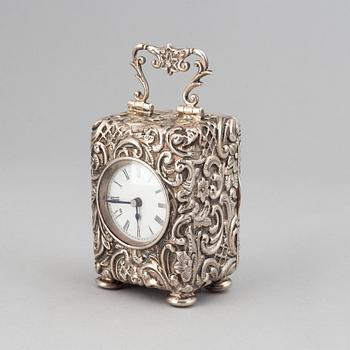 A rococo-style silver clock, mark of Henry Matthews, Chester 1903.
