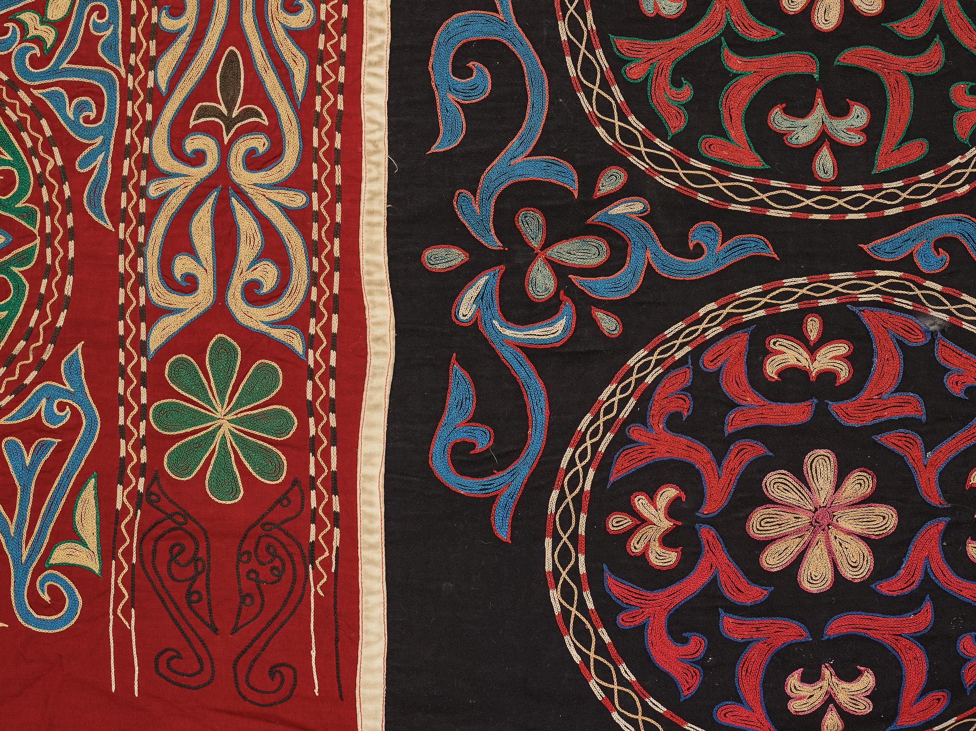 A Suzani textile, ca 247 x 128 cm.
