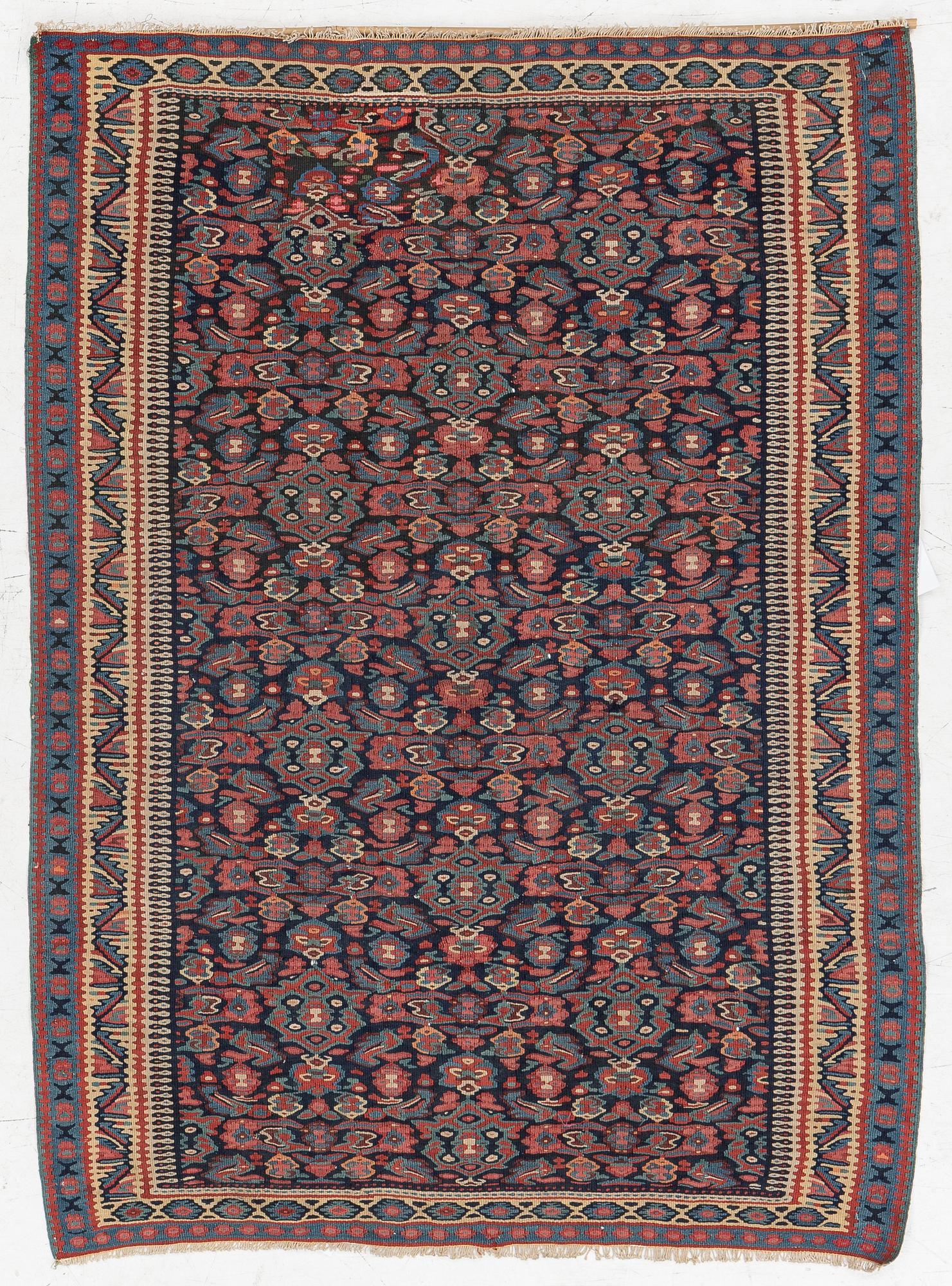 An antique Senneh kilim, West Persia, c. 149 x 11 cm.