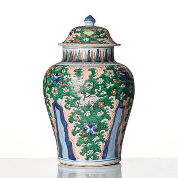 A Transitional wucai 'flying horse' baluster jar with cover, 17th century.