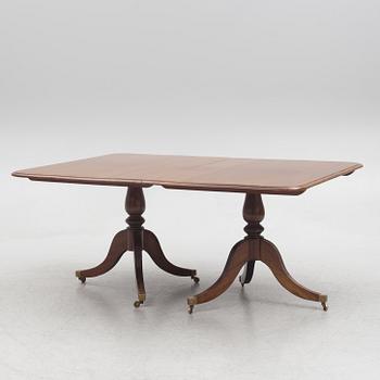 A two-part mahogany Georgian/Victorian dining table, England, first half of the 20th century.