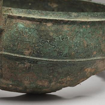 A bronze tripod food vessel and cover, "Ding", Eastern Zhou Dynasty.