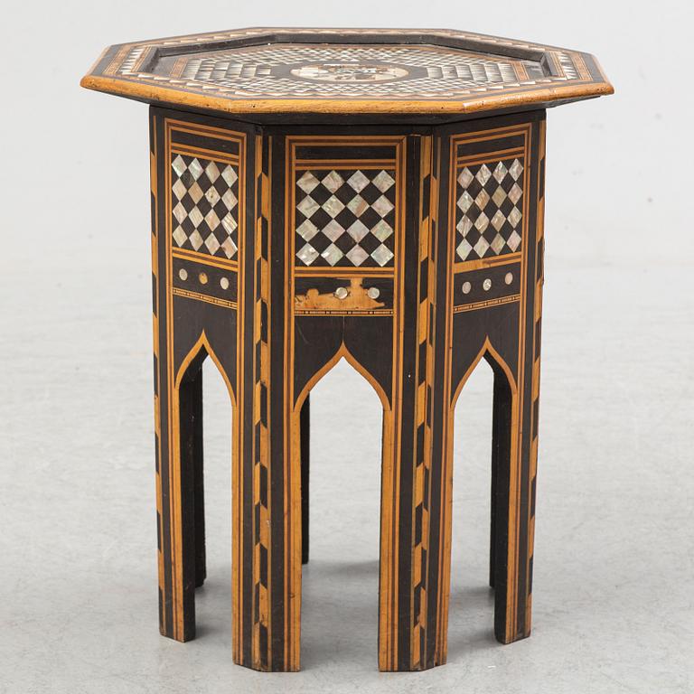 A mother of pearl and wood small table, 20th century.