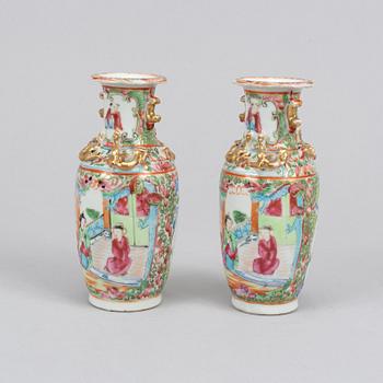 A pair of famille rose Canton table lamps and a pair of vases, late Qing dynasty, 19th Century.