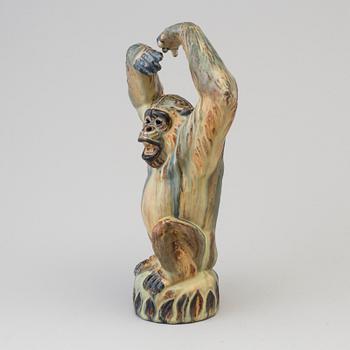 A Danish mid 20th century glazed ceramic figure of a chimpanzee, by Arne Ingdam.